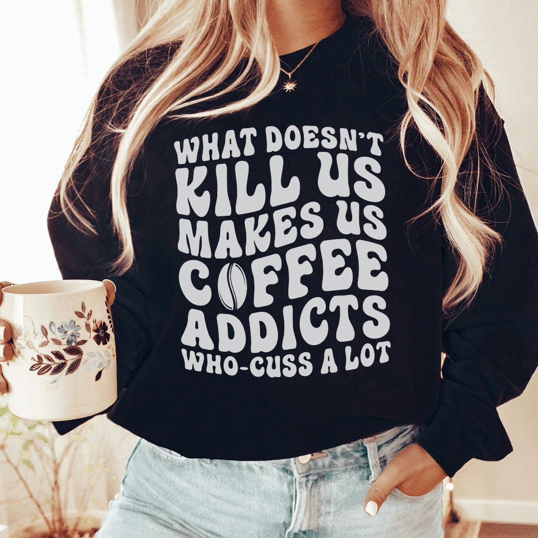 What Doesn't Kill Us Makes Us graphic sweatshirt with cotton-poly fleece lining and banded cuffs